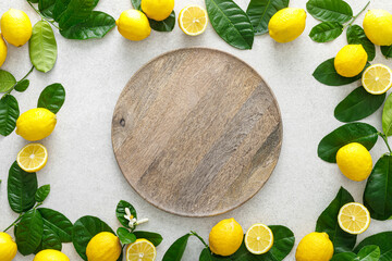 Sticker - Lemons. Fresh juicy lemons with leaves on white background