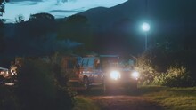 Night Stop On Africa Safari, Wild Camping Glamping Under Moonlight Night Sky, With Truck, Tent And Lights. Scientific Expedition In Tanzania, Professional Cinema Equipment, Leica Optics, Downscale 6K.