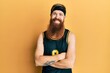 © Krakenimages.com - Redhead man with long beard wearing basketball uniform happy face smiling with crossed arms looking at the camera. positive person.
