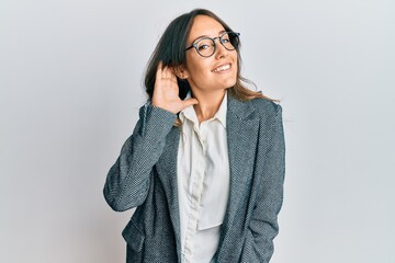 Young brunette woman having conversation talking on the smartphone skeptic and nervous, disapproving expression on face with crossed arms. negative person.