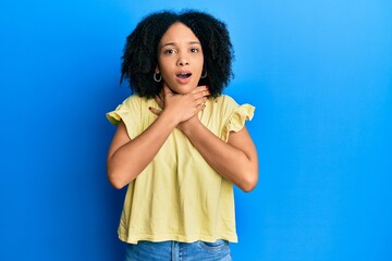 Poster - Young african american girl wearing casual clothes shouting and suffocate because painful strangle. health problem. asphyxiate and suicide concept.