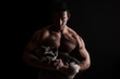 © Eskymaks - Handsome bodybuilder holding yorkshire terrier.