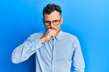 Sticker - Young hispanic man wearing casual clothes and glasses feeling unwell and coughing as symptom for cold or bronchitis. health care concept.