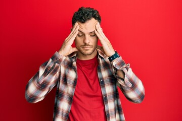 Poster - Young hispanic man wearing casual clothes with hand on head, headache because stress. suffering migraine.