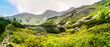 © vladimir - A crystal clear from stream flowing into mountain lake with green grass and mountains around and cloudy sky, Rohace, Rohacske plesa, Slovakia