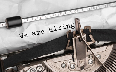 Poster - text we are hiring typed on retro typewriter