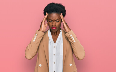 Wall Mural - Young african american girl wearing business clothes suffering from headache desperate and stressed because pain and migraine. hands on head.
