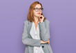© Krakenimages.com - Young caucasian woman wearing business style and glasses with hand on chin thinking about question, pensive expression. smiling and thoughtful face. doubt concept.