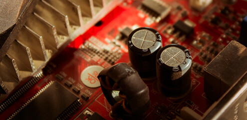 Details of the old computer graphics card on a gray background. Old red graphics card. GPU
