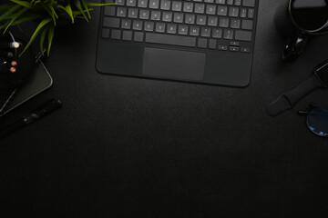Fototapete - Top view of modern dark office with wireless keyboard, smart watch coffee cup on on black leather.