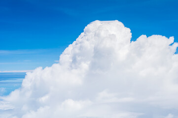 over the clouds,Blue sky with tiny clouds background Beautiful natural view from airplane window above. Background or Wallpaper.blue sky and cloud sky nature.Top view of aircraft