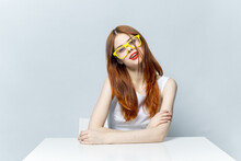 Woman In Yellow Glasses Sitting At The Table Smile 