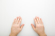 © fotoduets - Young adult man hands on light gray table background. Closeup. Point of view shot. Top down view.