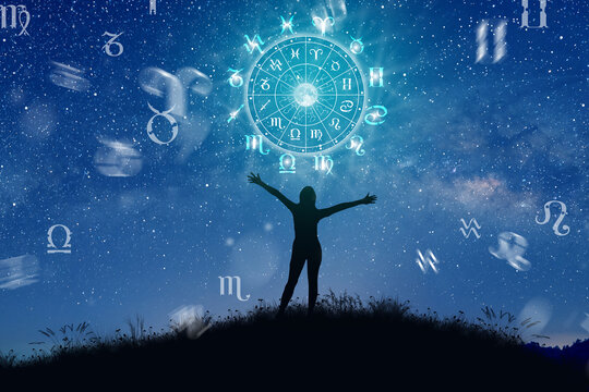 Wall Mural -  - Astrological zodiac signs inside of horoscope circle. Illustration of Woman silhouette consulting the stars and moon over the zodiac wheel and milky way background. The power of the universe concept.