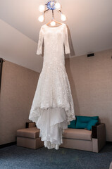 Wall Mural - The wedding dress is hanging on a hanger