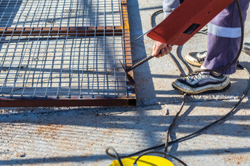 Wall Mural - Metalworking master doing electricity welding