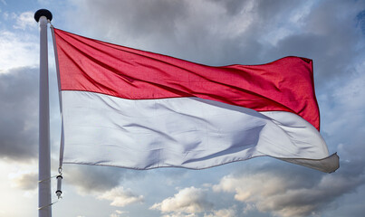 Canvas Print - Indonesia flag waving against cloudy sky