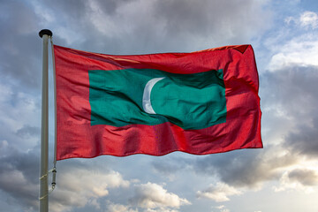 Poster - Maldives flag waving against cloudy sky