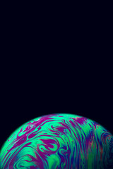 Wall Mural - Bubble color. Globe planet earth in galaxy universe space with abstract sun on black background. Color abstract fluorescent inks in water.