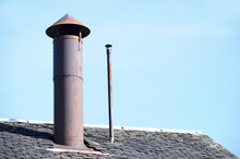 Flue Chimney Fixed To Building Exterior Slate Roof