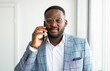 © Alexandr - handsome african man with mobile phone
