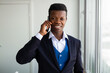 © Alexandr - handsome african man with mobile phone