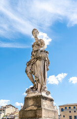 Wall Mural - Statue of Spring, sculpted by Italian artist Pietro Francavilla in early 17th century on the Santa Trinita Bridge in Florence city center, Tuscany, Italy