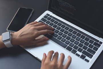 Woman hand typing on keyboard, online working on laptop computer