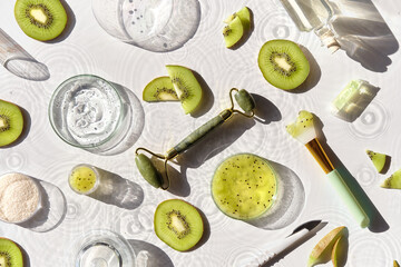 cosmetic skincare background. herbal medicine with kiwi slices and palm leaves. homemade sugar scrub