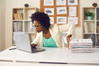 © Studio Romantic - Convenient electronic bookkeeping vs stacks of papers. Secretary or financial accountant organizing digital documents on computer. Young woman sitting at office desk and doing paperwork on laptop