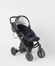 Modern Baby Stroller On Grey Background