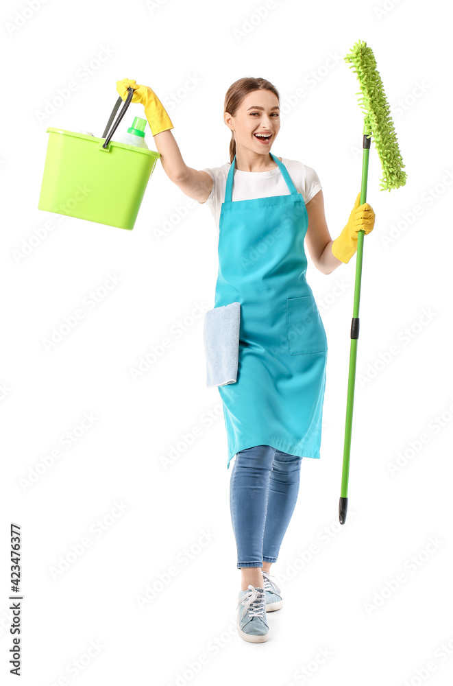 Young woman with cleaning supplies on white background