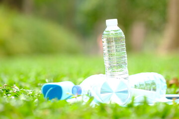 Wall Mural - bottle of water on grass