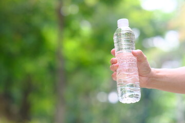 Poster - hand holding bottle of water