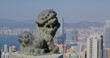 Victoria Peak, Hong Kong 05 February 2021: Hong Kong skyline with lion statue