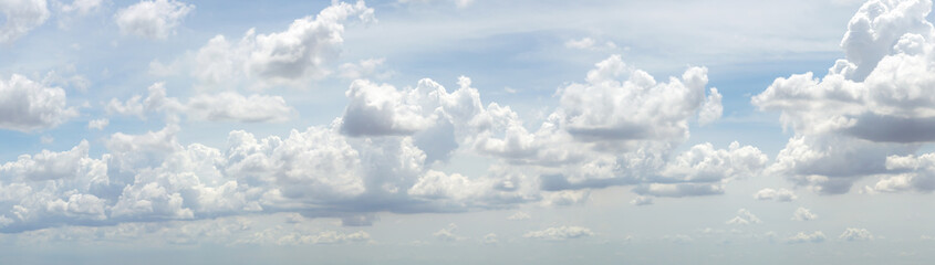Wall Mural - blue sky background with tiny clouds. panorama white fluffy clouds in the blue sky.Beautiful vast blue sky with amazing cloud background.Wide sky panorama with scattered cumulus clouds.