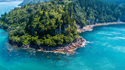 Wall Mural - Aerial view of a beautiful harbour with rocky coastline. Coromandel, New Zealand.