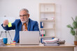 © Elnur - Old businessman employee sitting in the office