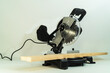 Electric circular metal saw for cutting wood on white background.