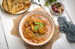 © PrabhjitSingh - spicy gravy chicken served in a  bowl with butter naan