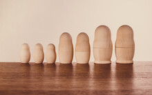 Family Of Nested Russian Dolls, Concept. Soft Brown Colors, Wooden Materials.
