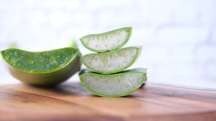 Wall Mural - Close-up Fresh Aloe vera sliced on a chopping board