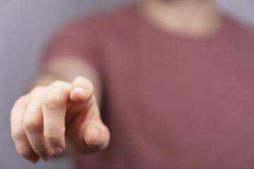 Poster - A man hand touching virtual screen, modern background concept , can put your text at the finger, copy space.