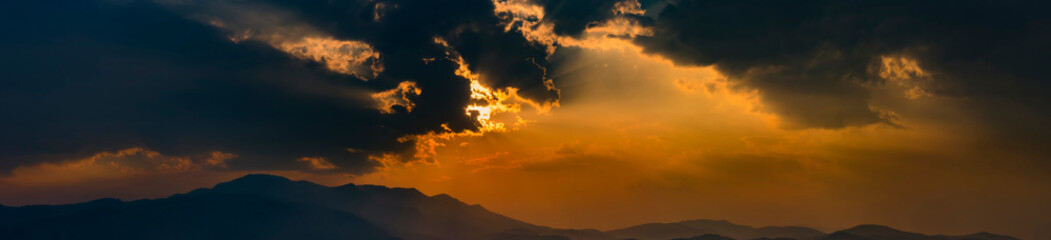 Wall Mural - sun behide the cloud with sunset for background