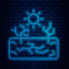 Sticker - Glowing neon line Drought icon isolated on brick wall background. Vector