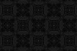Geometric 3D volumetric convex black background. Ethnic embossed floral ornament. African, Mexican, Indian style. A graceful pattern for wallpaper, presentations, stained glass.