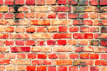 Texture of a brick wall with cracks and scratches which can be used as a background