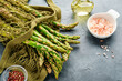 Asparagus. Fresh green asparagus bunch ready for cooking on gray slate stone table background. Top view copy space.