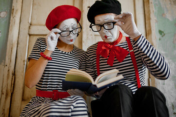 Two clowns in glasses, mime artists, parody comedy