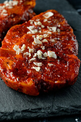 Wall Mural - Marinated raw steak, with coarse sea salt, on slate plate